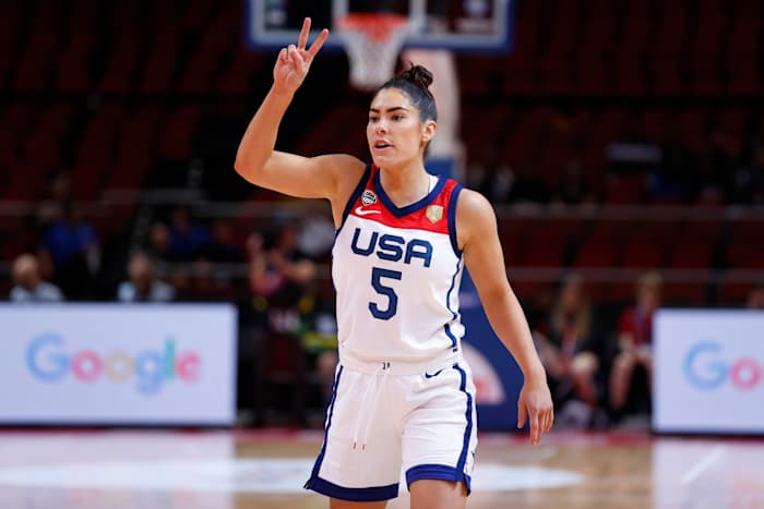 Kelsey Plum holds up two fingers during a game.